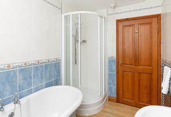 The family bathroom benefits from a separate shower cubicle.