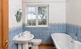 The bathroom has a luxurious roll-top bath and lovely country views. - Thumbnail Image