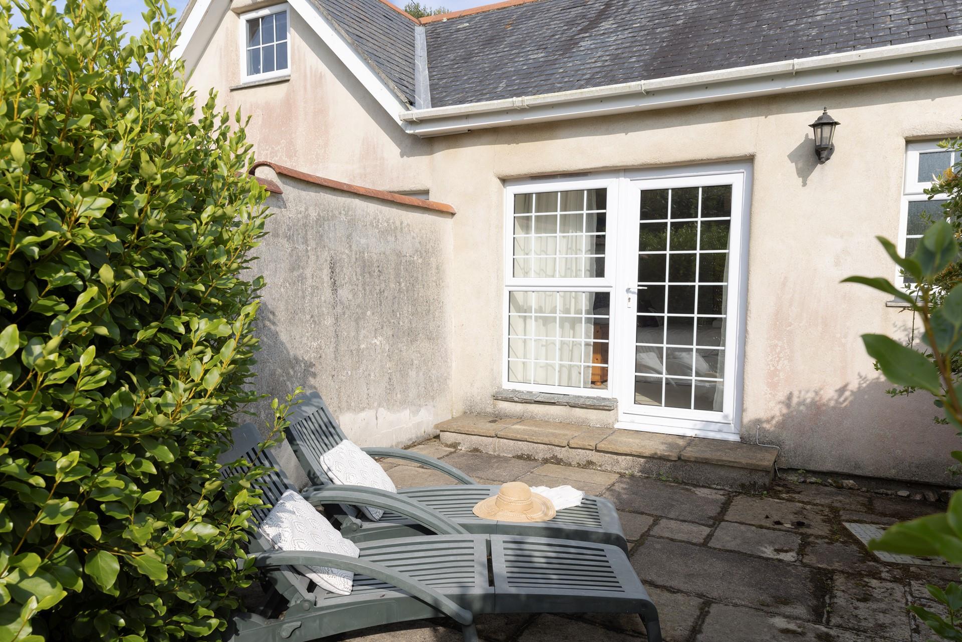 Sunbathe on the terrace on a warm summer afternoon after a morning stroll to the cove.