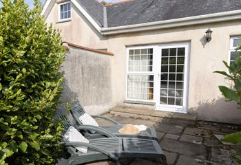 Sunbathe on the terrace on a warm summer afternoon after a morning stroll to the cove.