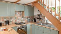 The family foodie will love to cook in the country-style kitchen.