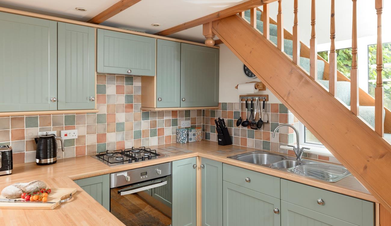 The family foodie will love to cook in the country-style kitchen.