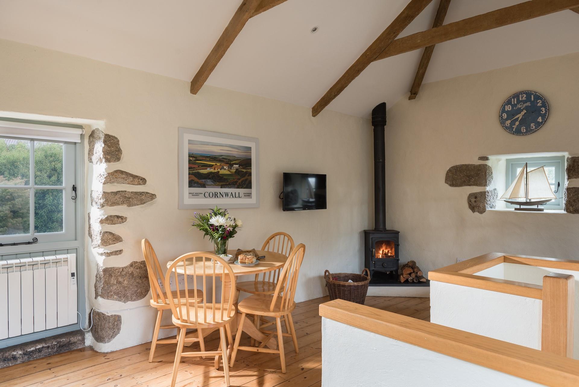 The barn retains many of its original features including wooden beams and exposed granite. 