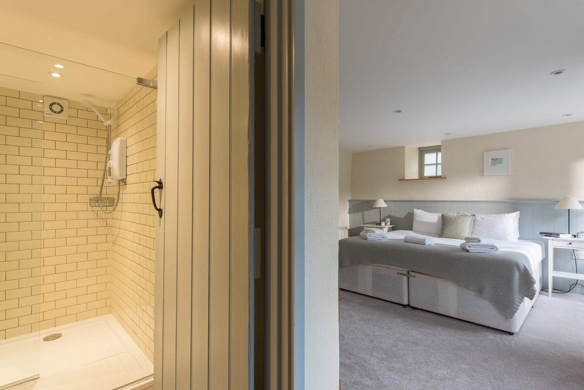 The bedroom is on the ground floor, with an en suite shower room. 