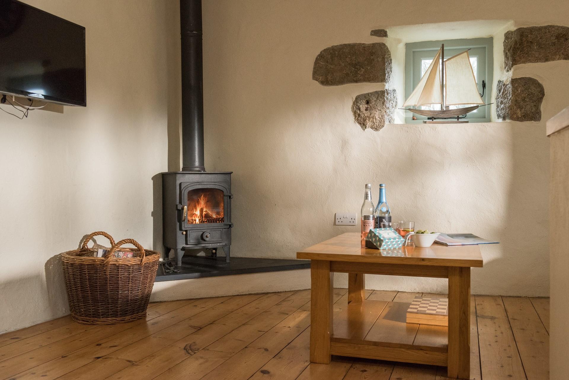 Keep toasty in the winter with a roaring fire and watch the flames as they dance in the log burner. 