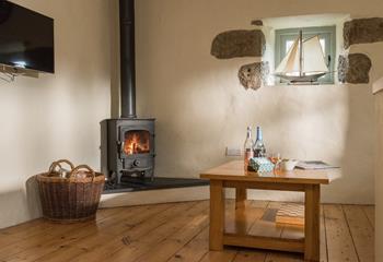 Keep toasty in the winter with a roaring fire and watch the flames as they dance in the log burner. 