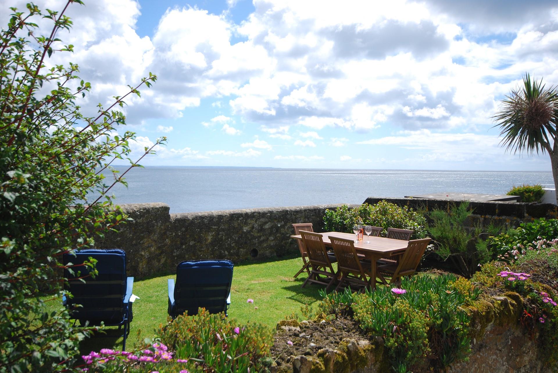 The blooming front garden has stunning ocean views.