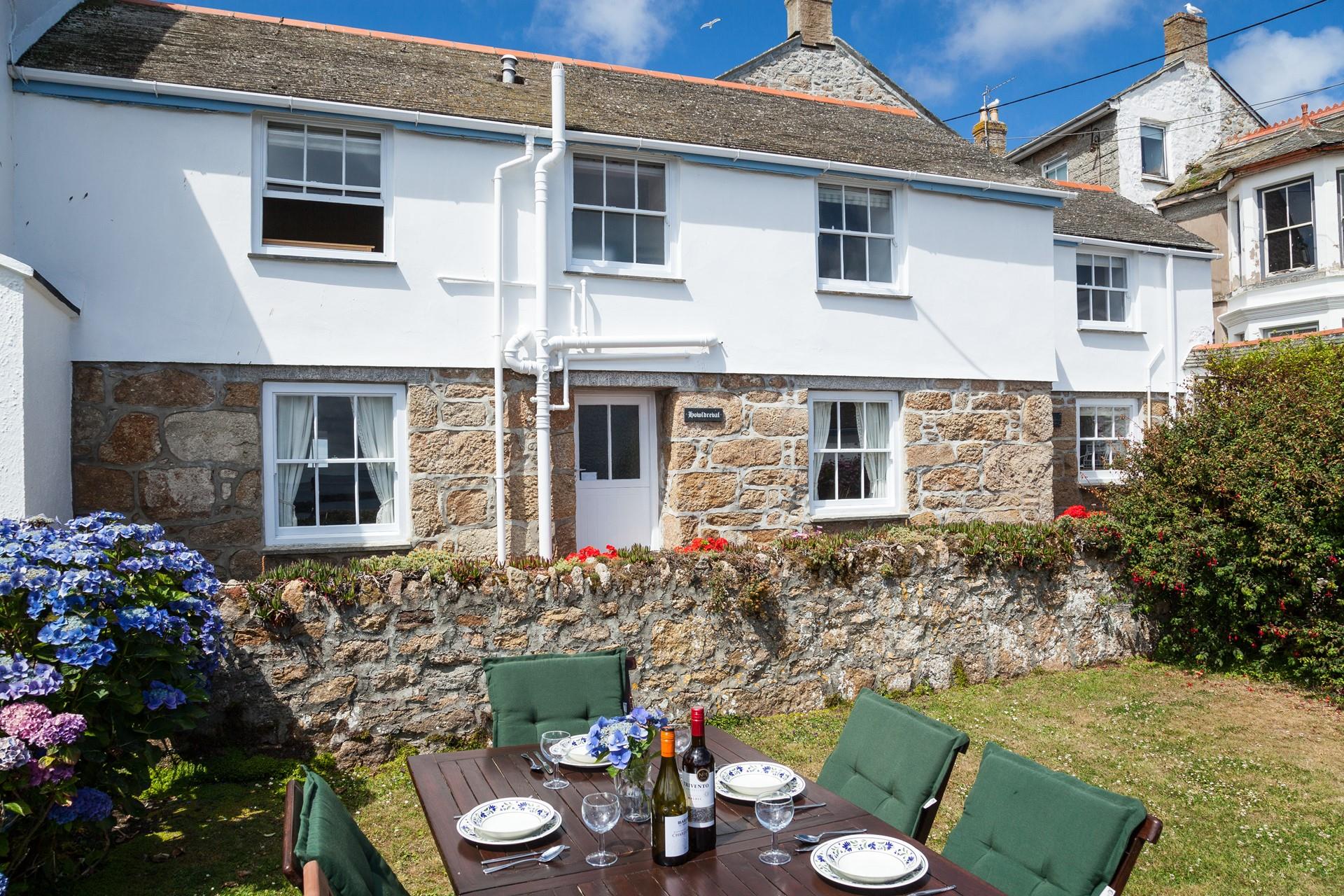 Spend long lazy afternoons in the sunny garden overlooking the sea.