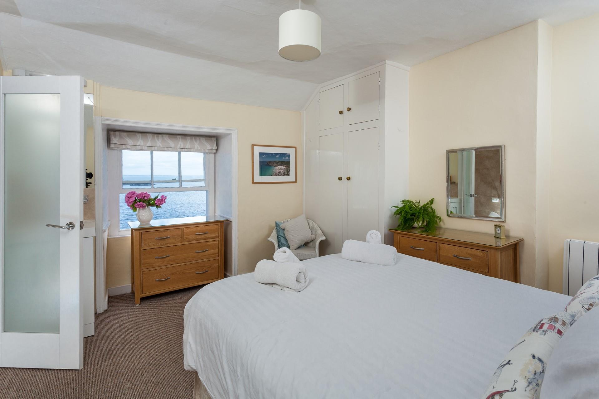 Wake up to stunning sea views and gaze out while you sip your morning cuppa in bed.