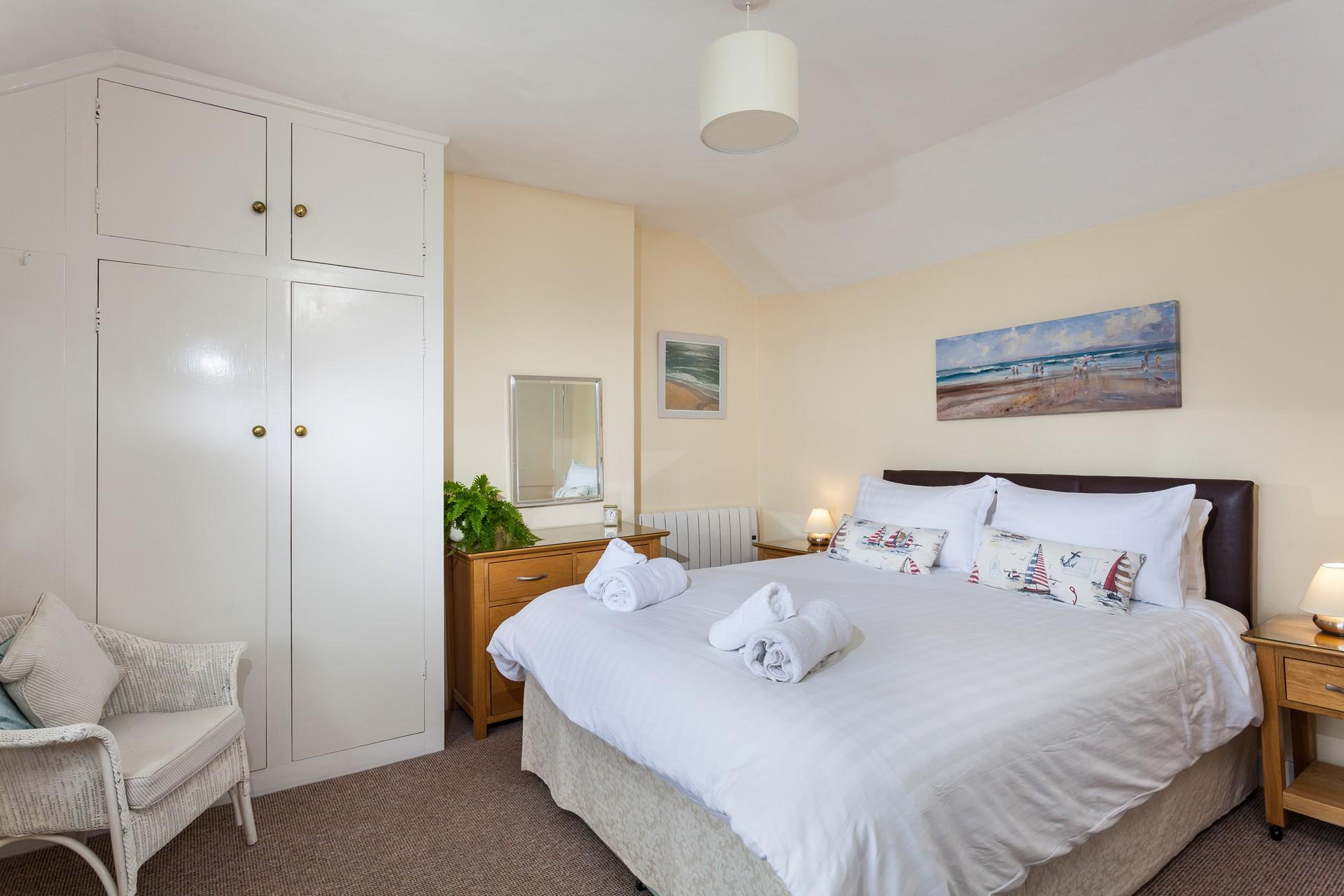 Bedroom 1 has a double bed and an en suite wet room.