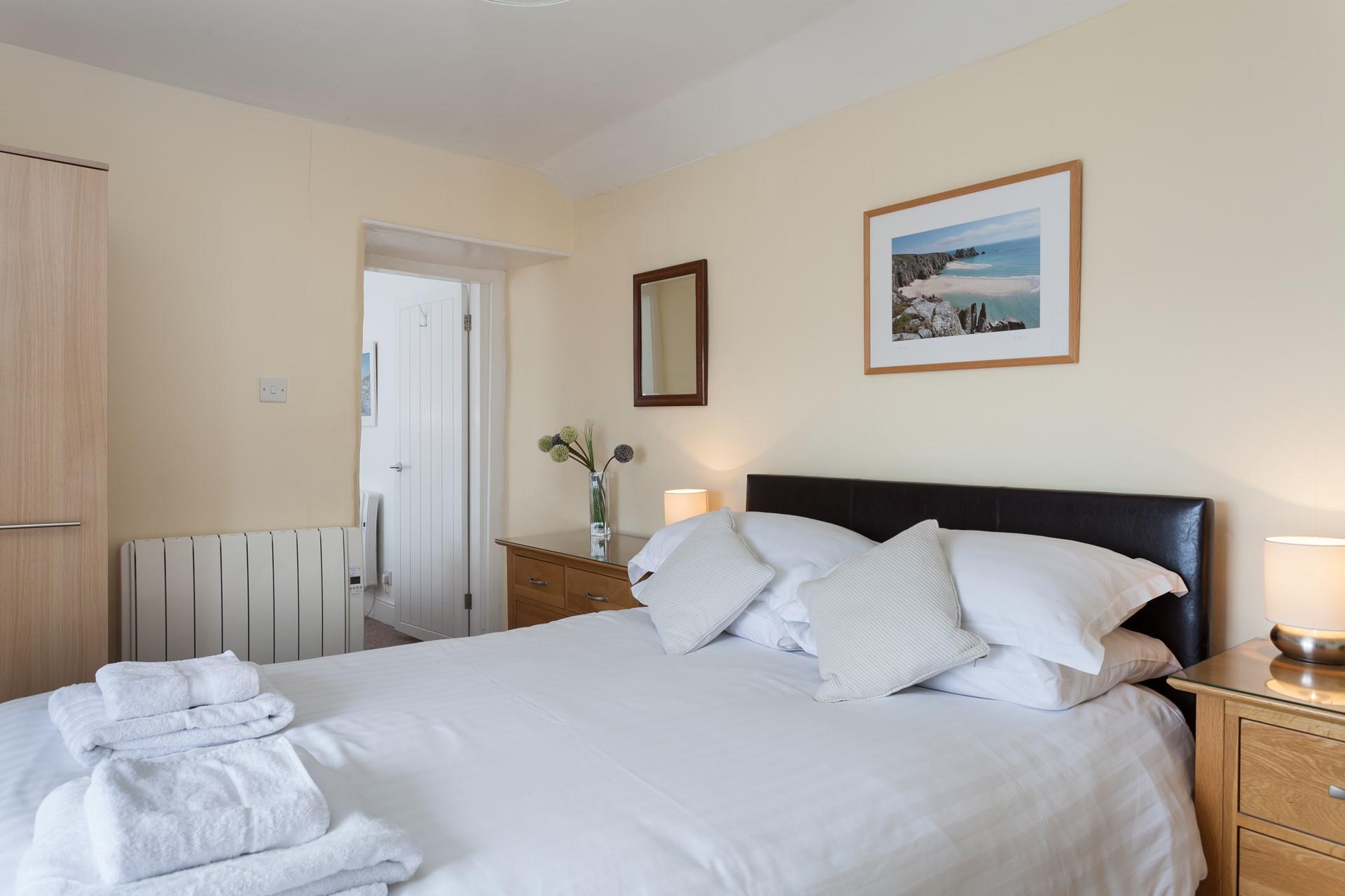 Bedroom 3 is adorned with Cornish artwork.