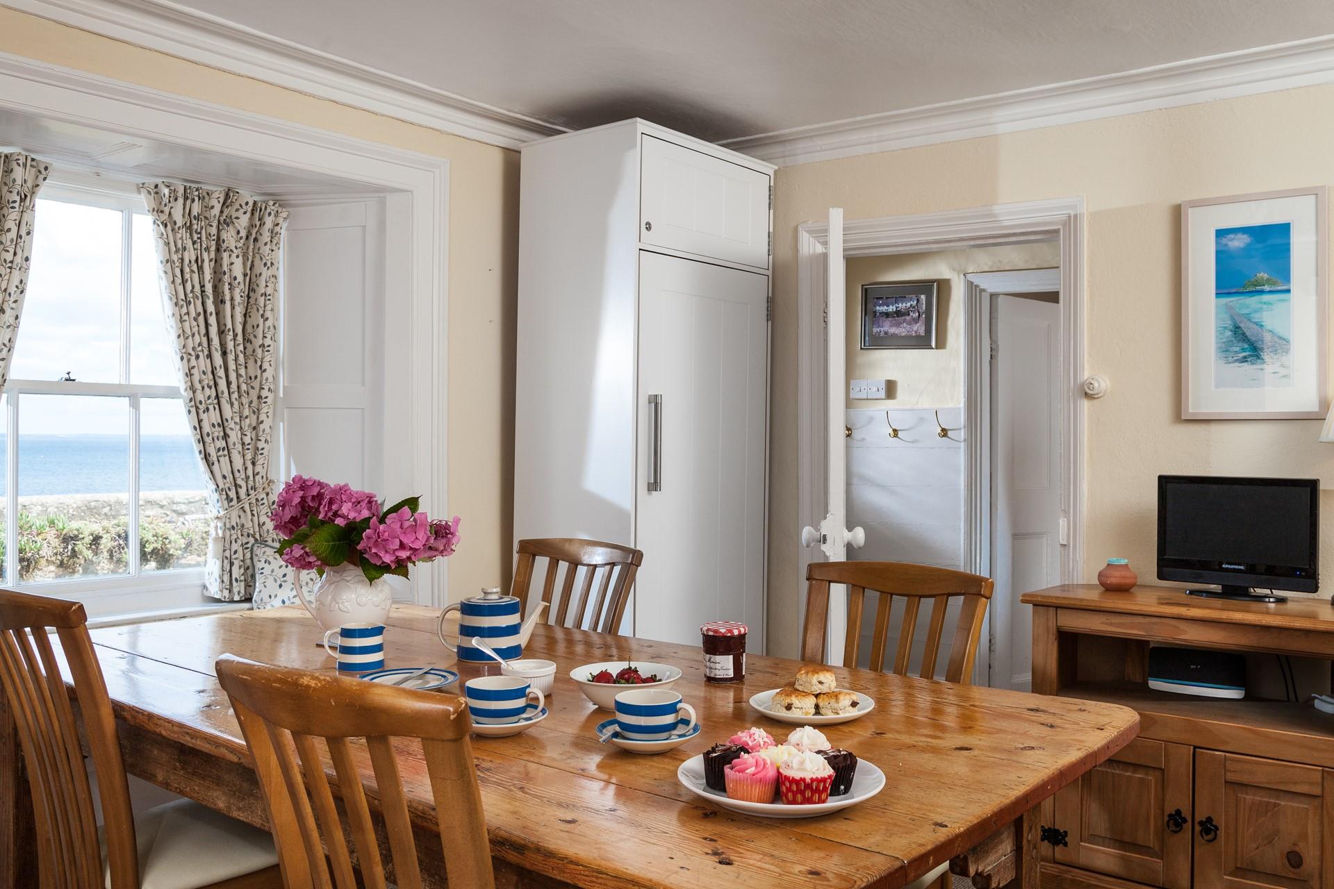 Enjoy breakfast, lunch, and dinner overlooking the garden and out to sea.