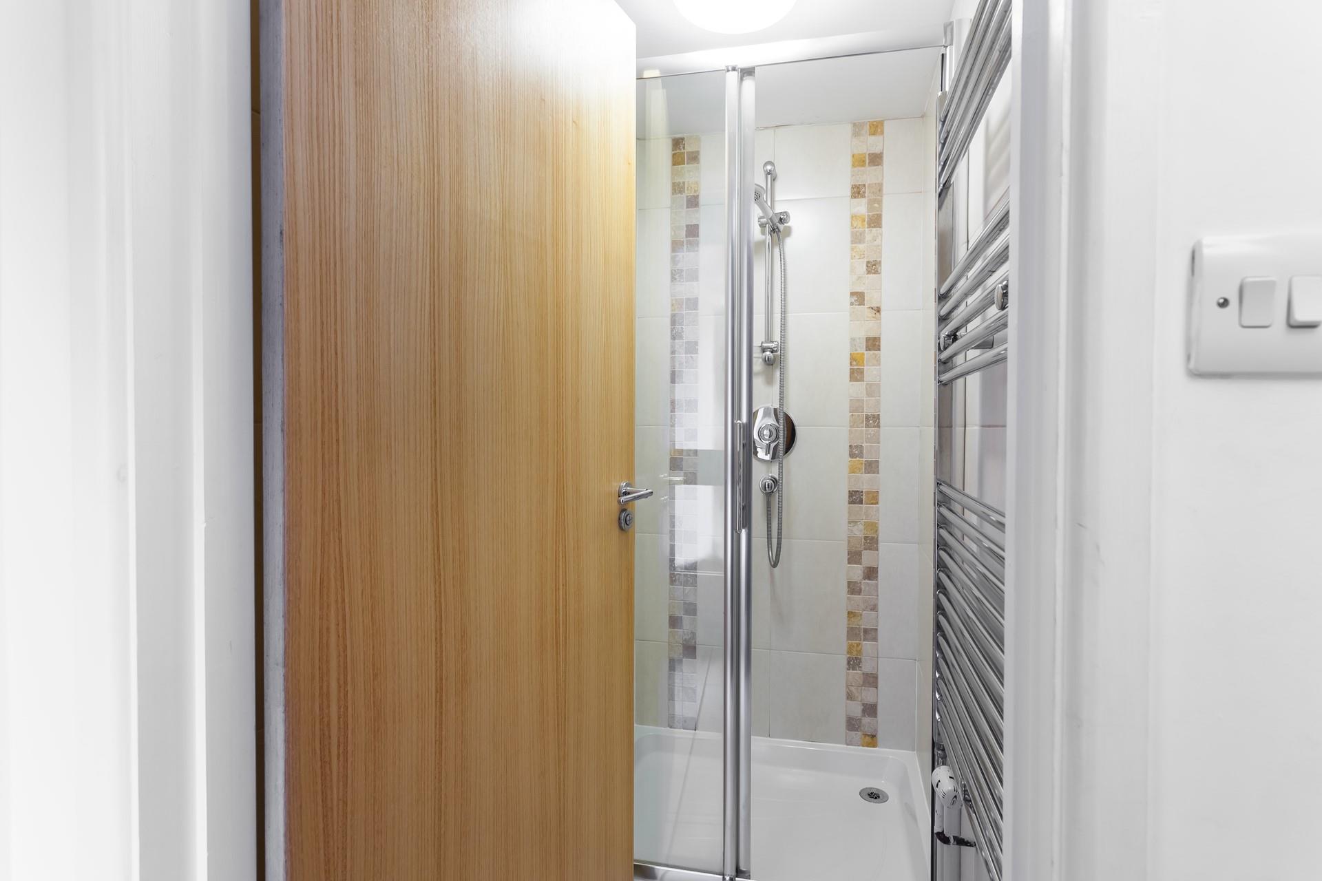 Wash off sandy toes in the shower after a day on the beach.