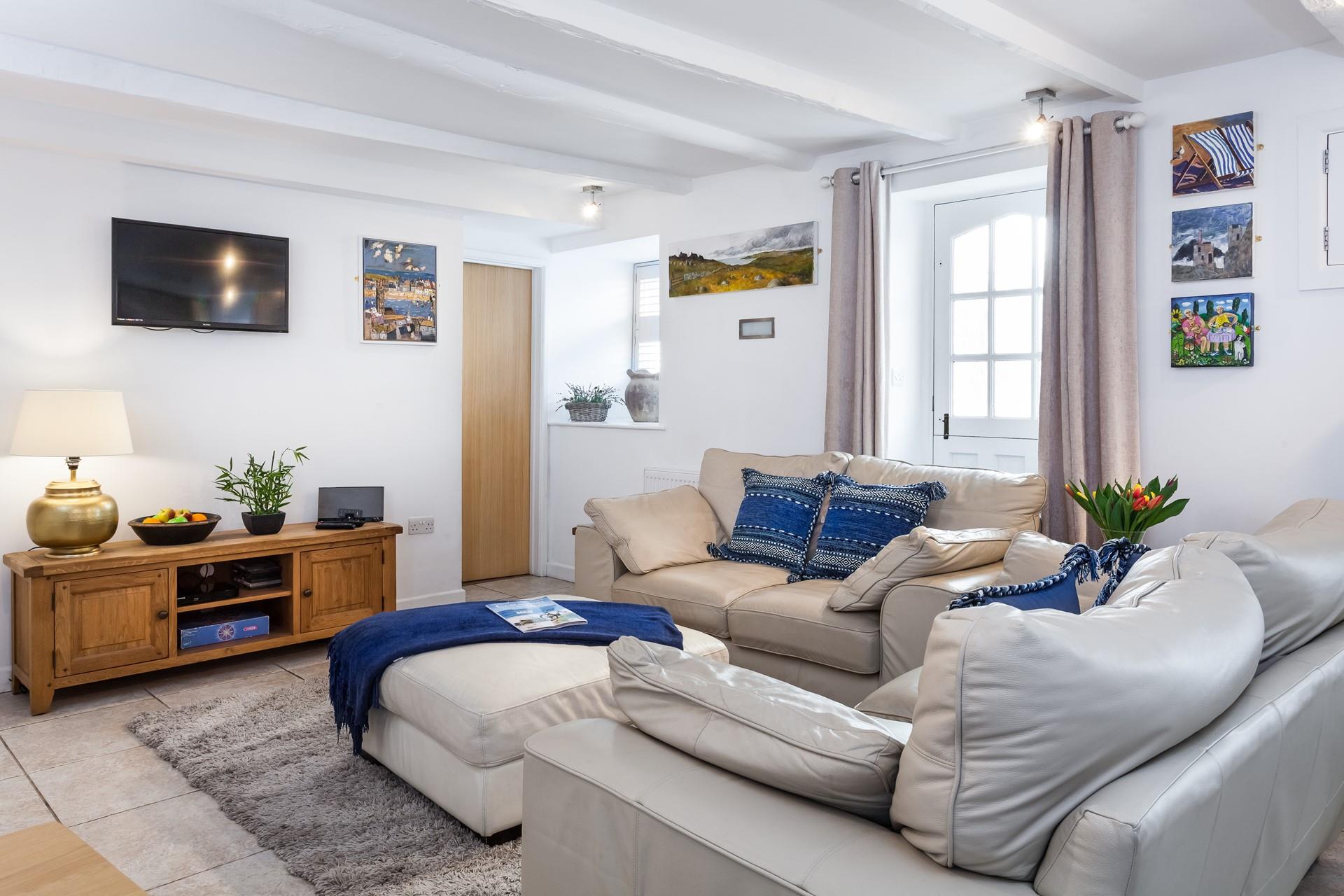 The sitting room is a cosy base to come back after exploring St Ives.