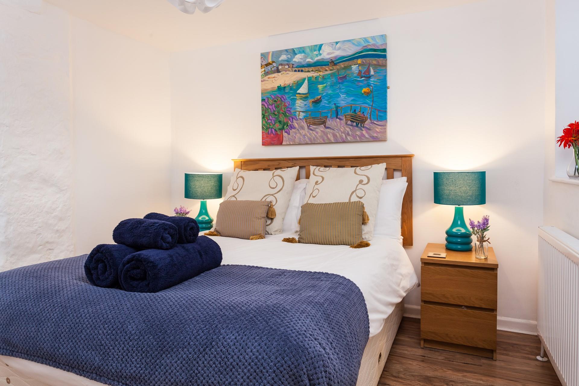 The cosy double bed offers a relaxing night's sleep.