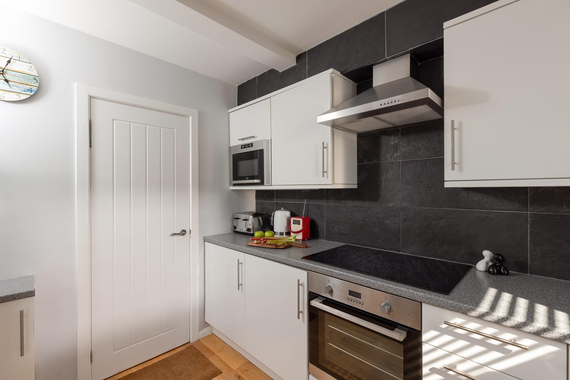 All the mod cons await in the sleek kitchen.