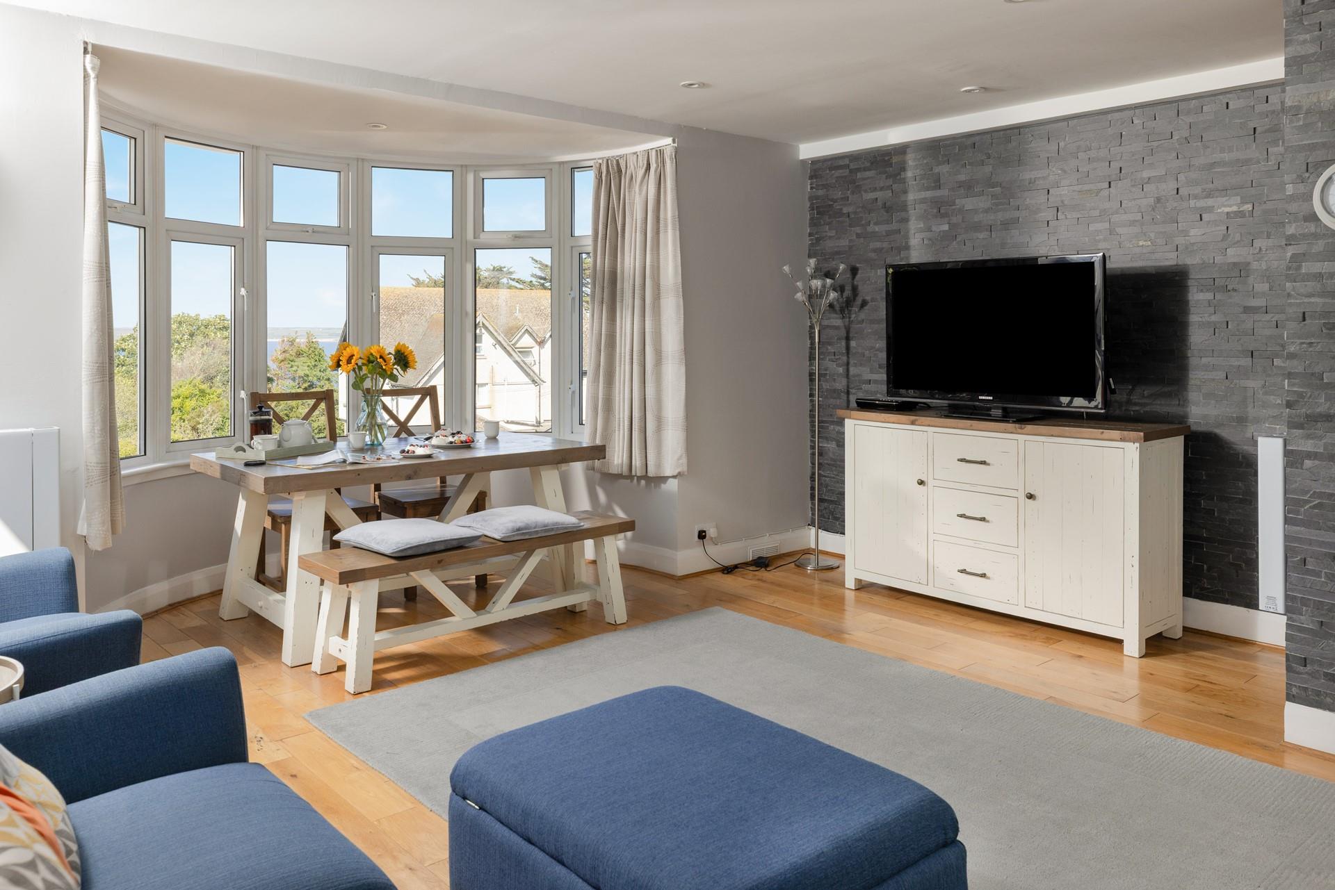 Open plan living and dining make the most of the view.