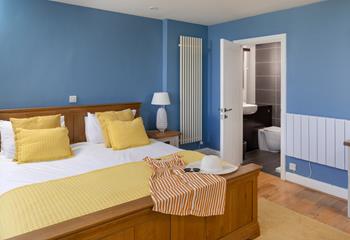 Bedroom 1 boasts a stylish en suite with a walk-in shower.