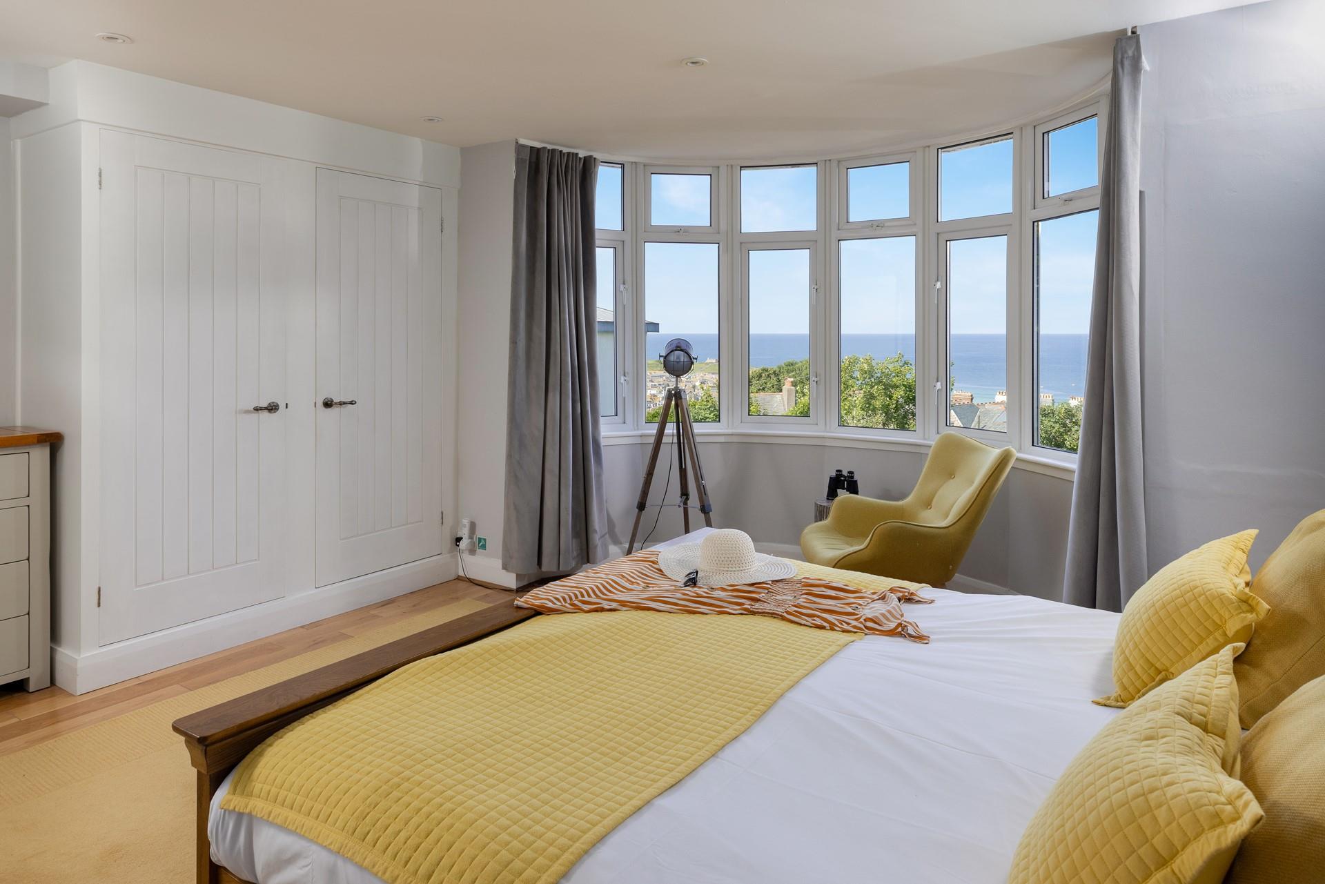 Wake up and take in the wonderful views from this spacious and bright bedroom.