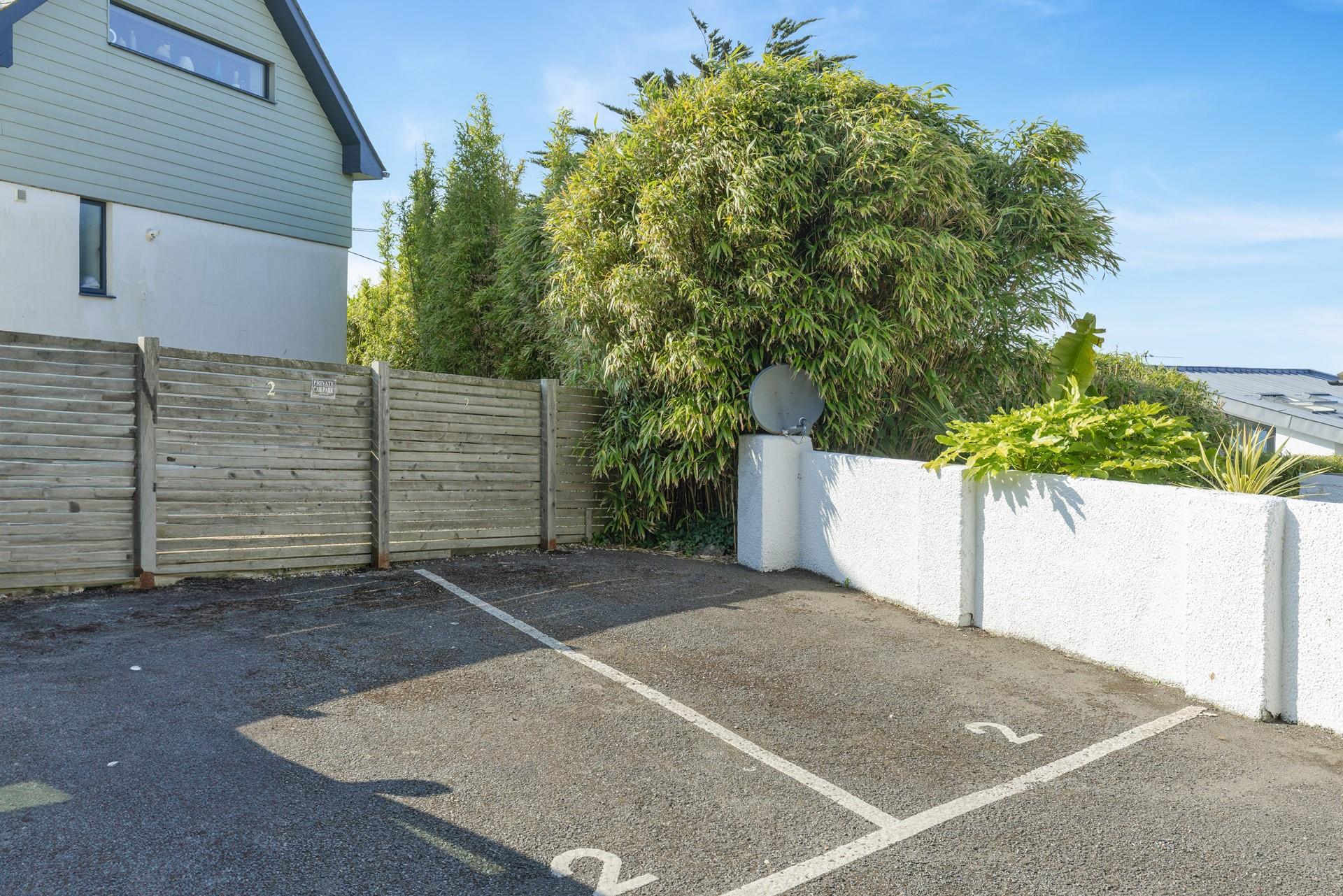 The property benefits from parking for two small cars.