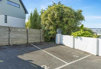 The property benefits from parking for two small cars.