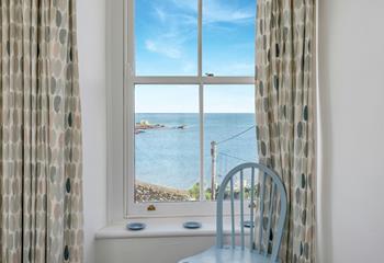 Relax in the window seat looking over the Cornish sea views. 