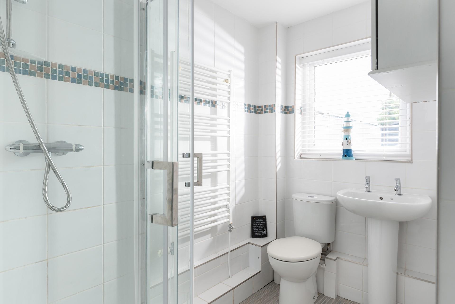 After a day at the nearby beach, Porthkidney Sands, wash off the sand in your corner shower. 