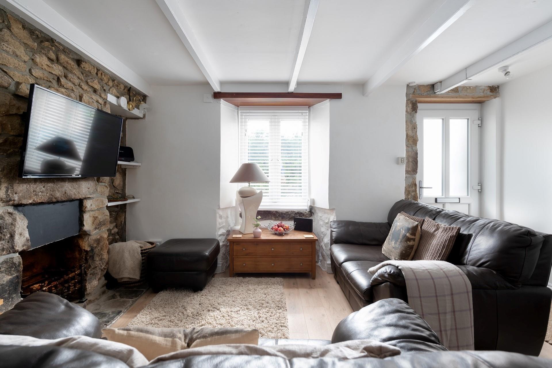 After a blustery beach walk, wander back and settle in front of the cosy woodburner effect fire.