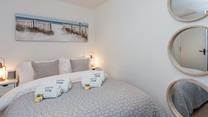 Snuggle under the soft sheets for a relaxing night's sleep.