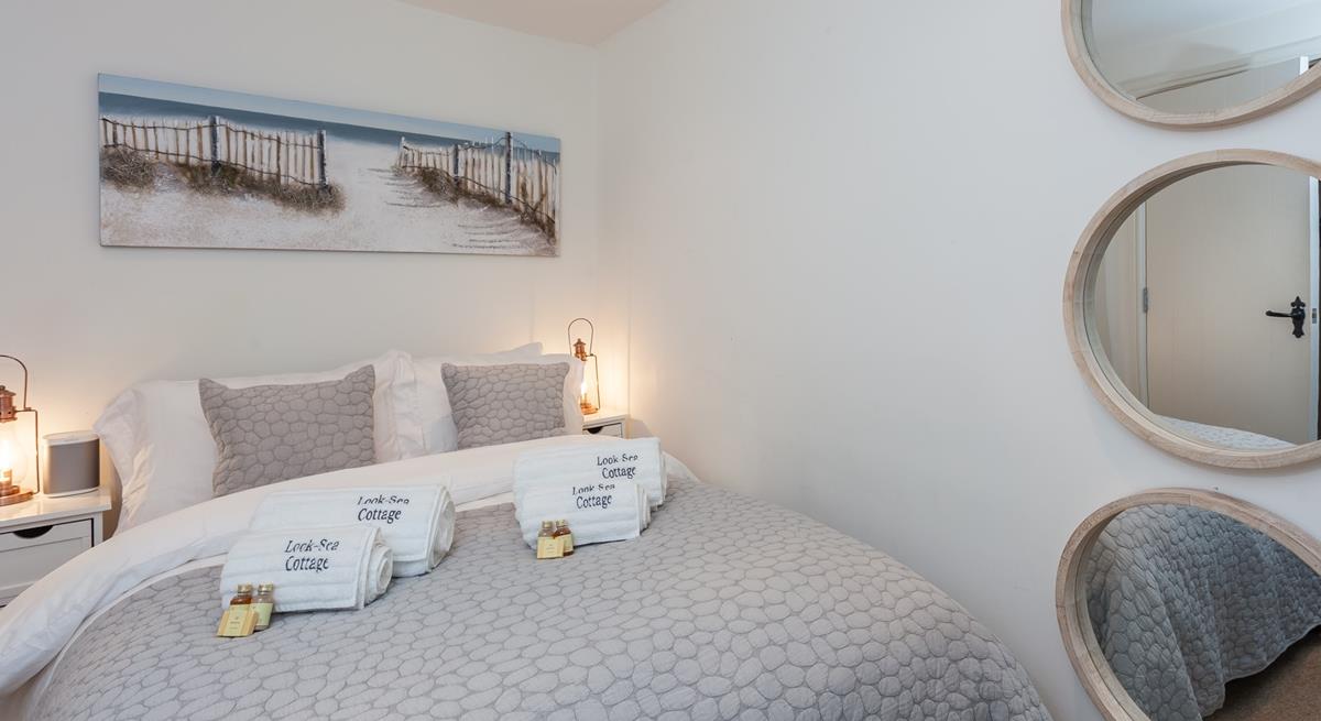 Snuggle under the soft sheets for a relaxing night's sleep.