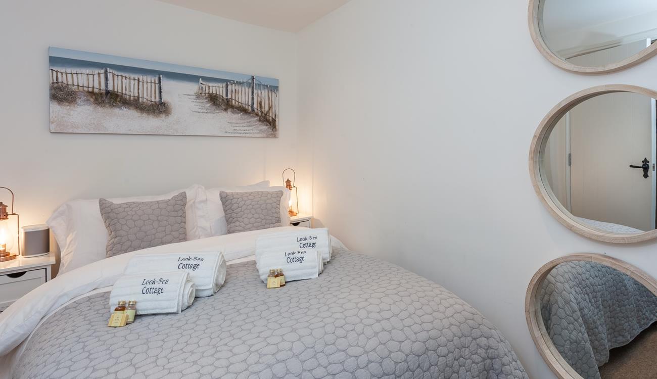 Snuggle under the soft sheets for a relaxing night's sleep.