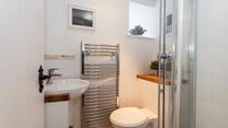 Wash off your sandy toes and salty skin in the shower after a day at the beach.