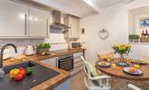 The modern spacious kitchen also has a lovely dining table to spend time as a family over meal times. - Thumbnail Image