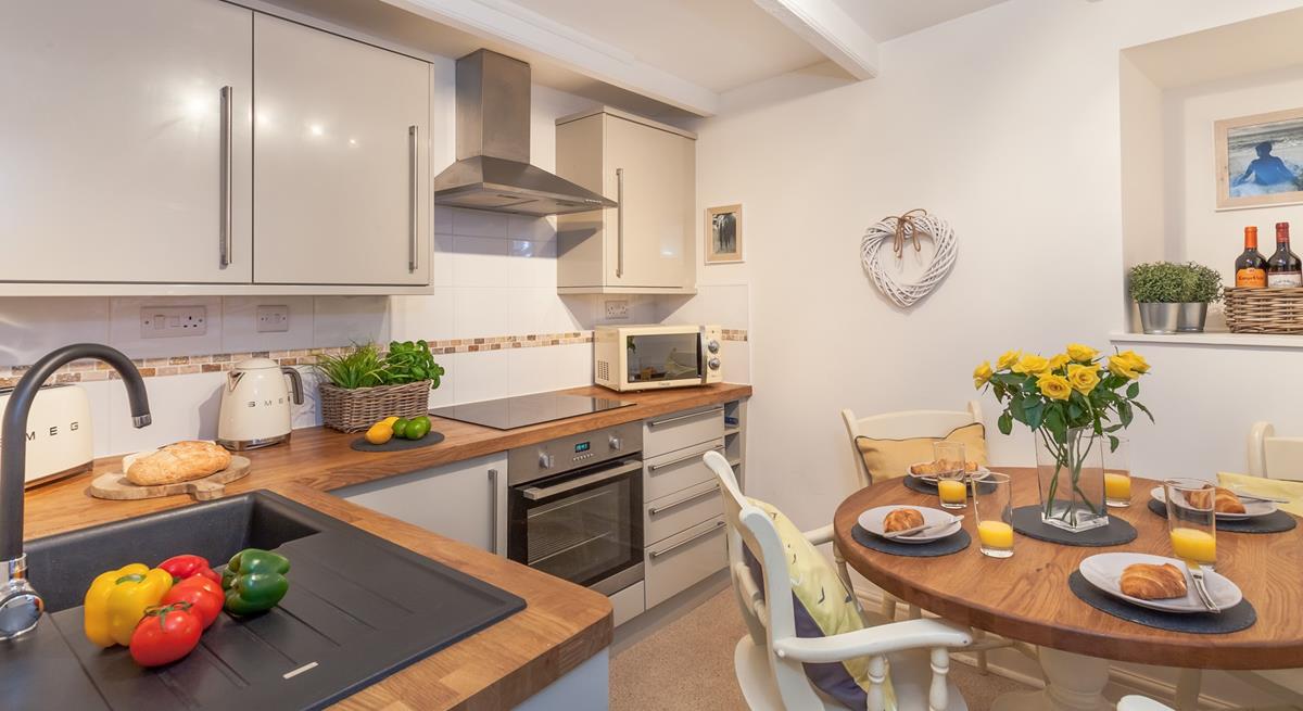 The modern spacious kitchen also has a lovely dining table to spend time as a family over meal times.