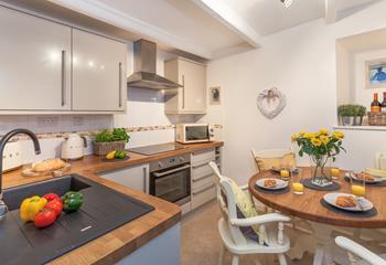 The modern spacious kitchen also has a lovely dining table to spend time as a family over meal times.