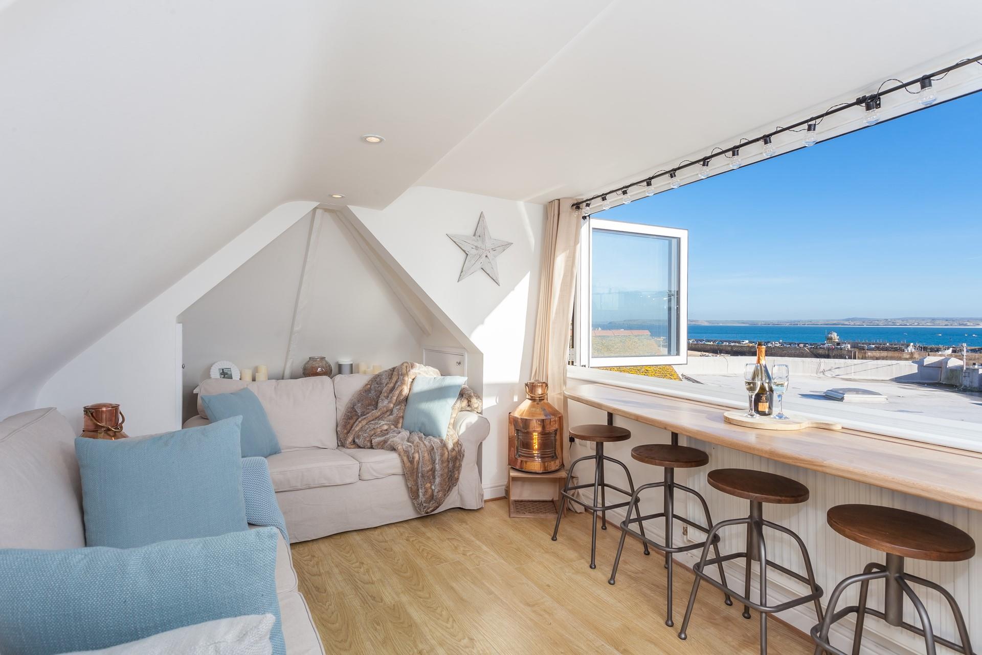 Soak up the views across the harbour from the top sitting room.