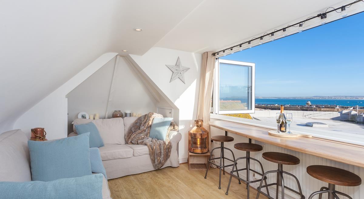 Soak up the views across the harbour from the top sitting room.