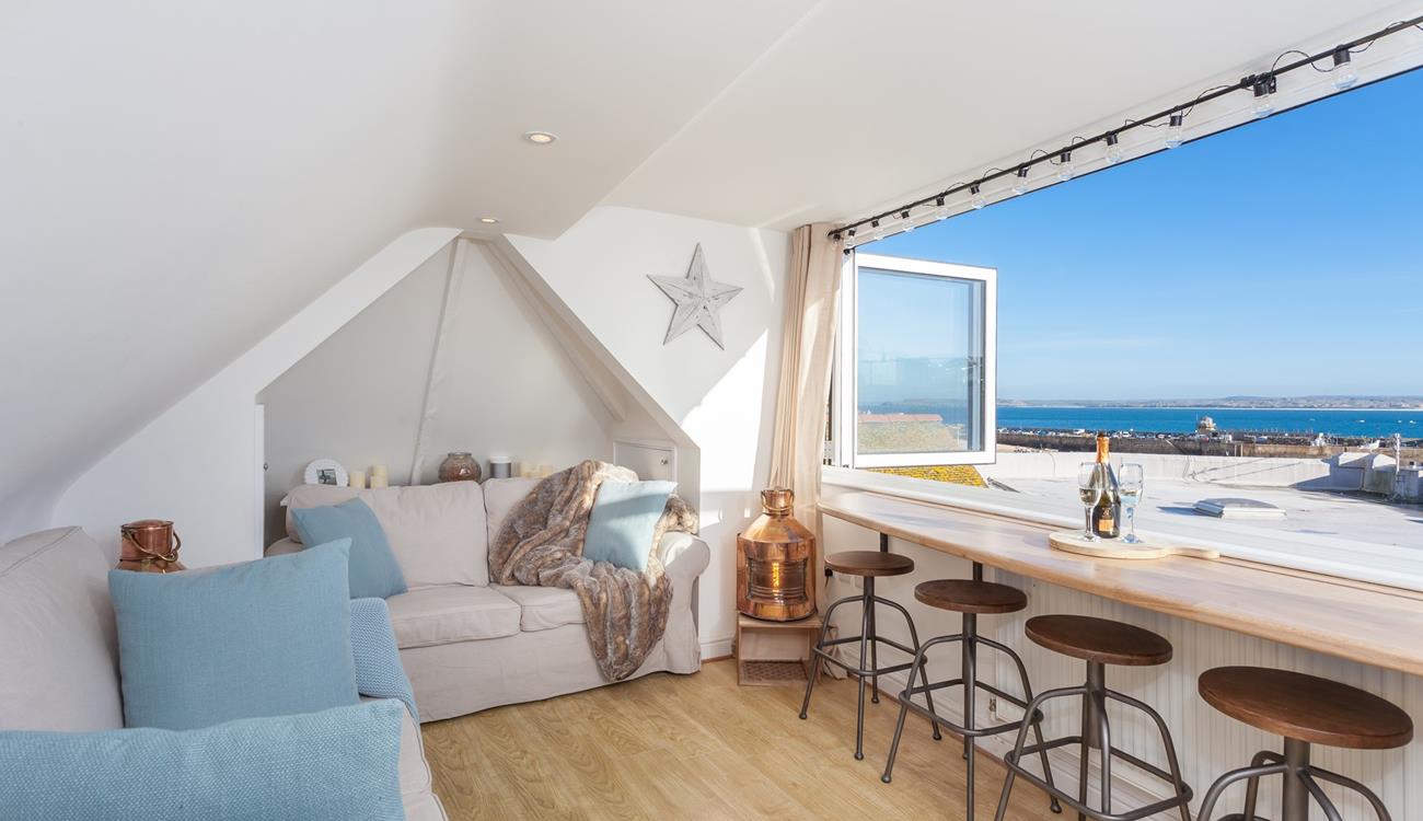 Soak up the views across the harbour from the top sitting room.