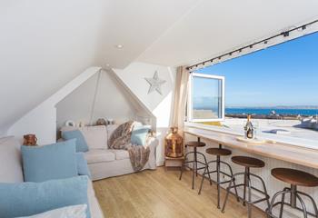 Soak up the views across the harbour from the top sitting room.