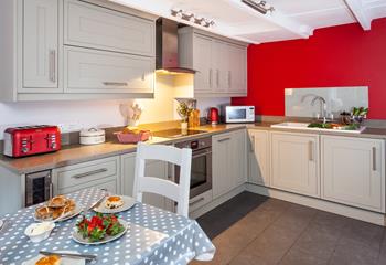 The kitchen also features a handy wine cooler- perfect for summer afternoons.
