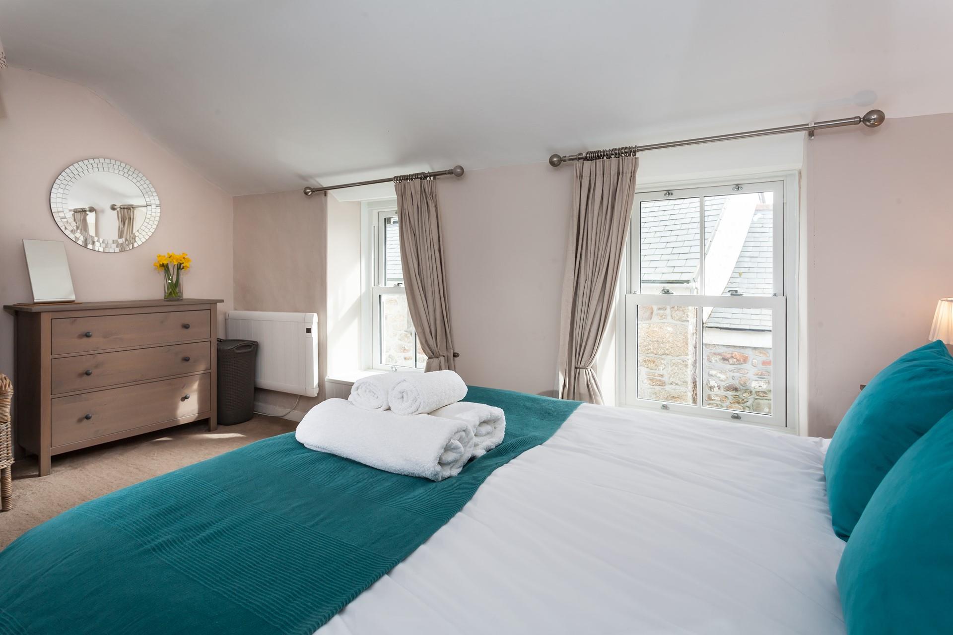 Bedroom 1 is beautifully finished and features a spacious king size bed for a dreamy night's sleep.