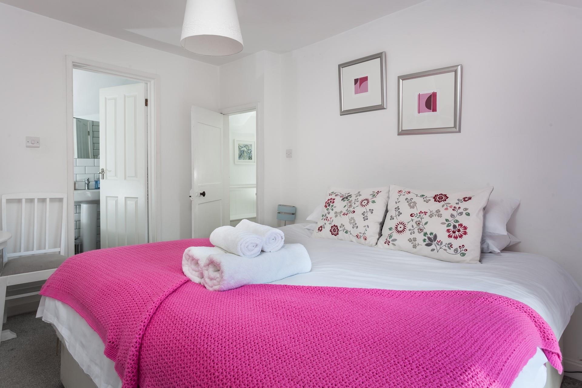 Wander into the en suite for a relaxing soak in the bath.