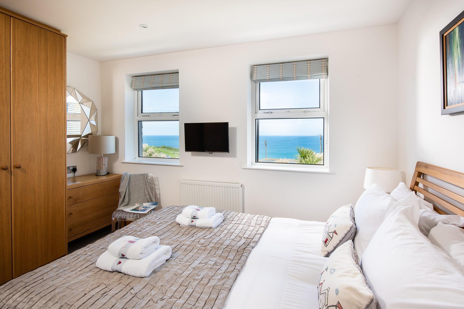 The plush king size bed promises a blissful night's sleep.