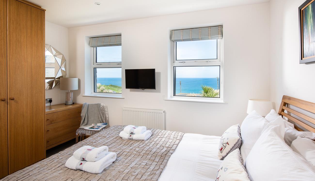 The plush king size bed promises a blissful night's sleep.