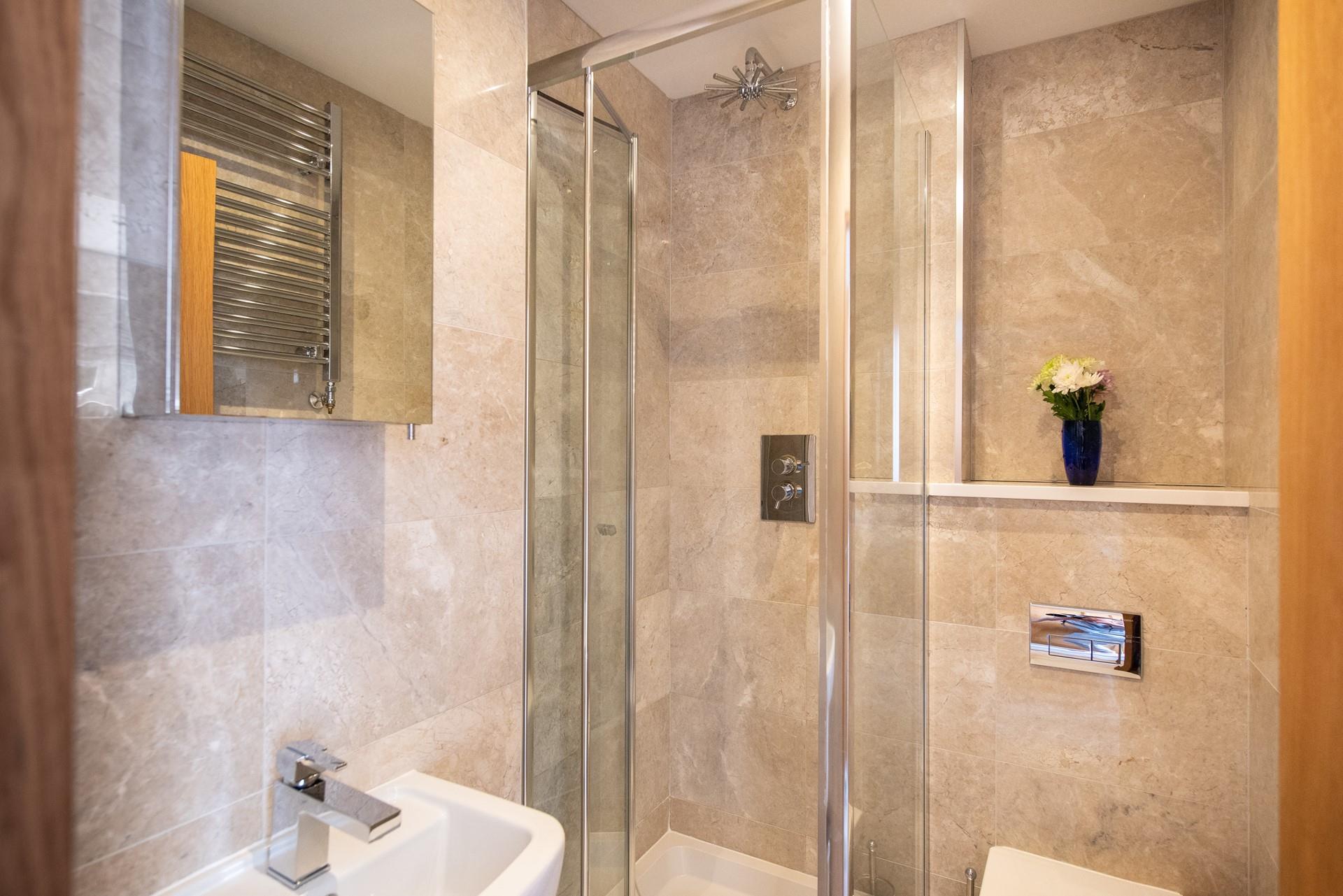 The main bathroom has a wonderful, sleek design with modern fixings.