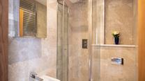 The main bathroom has a wonderful, sleek design with modern fixings.