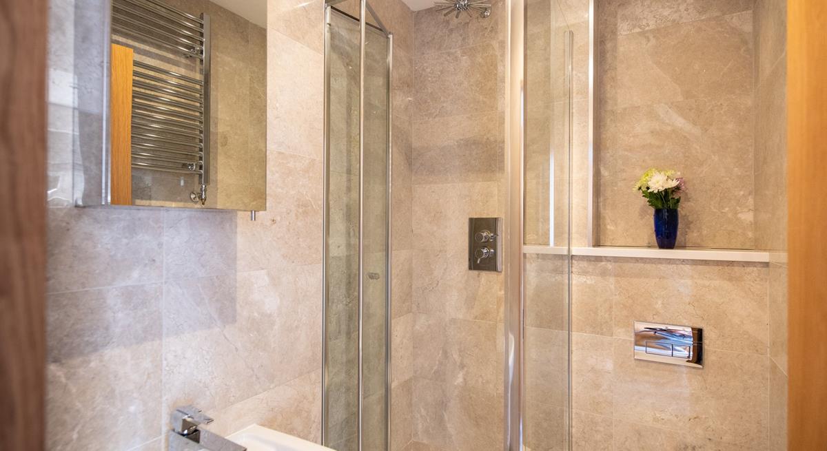 The main bathroom has a wonderful, sleek design with modern fixings.