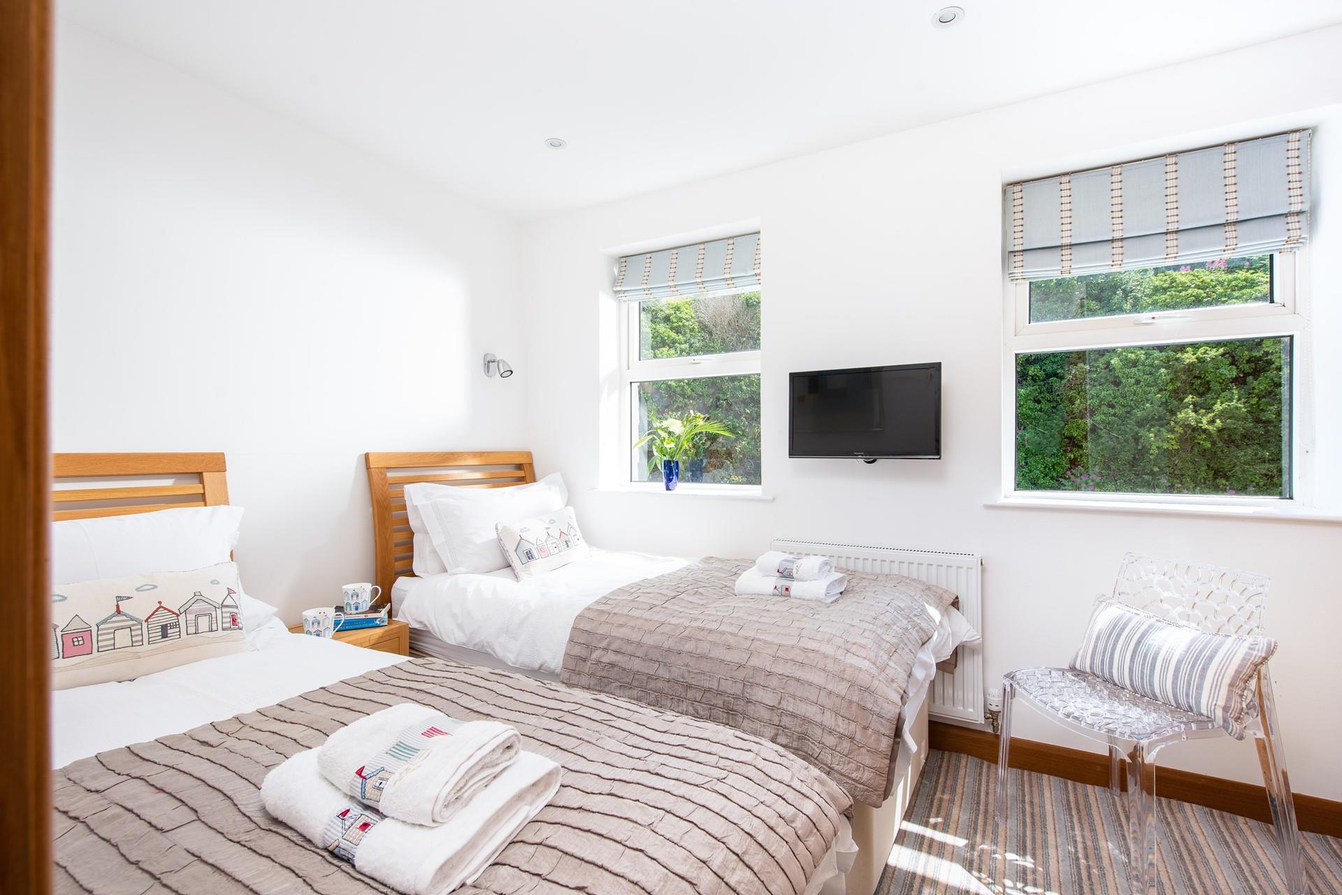 Bedroom 2 benefits from a TV for those lazy mornings in bed.