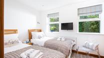 Bedroom 2 benefits from a TV for those lazy mornings in bed.