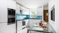 The open plan living makes it easy to socialise whilst cooking.